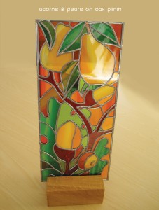 Stained glass - film & lead on oak patterned glass standing on a solid oak plinth