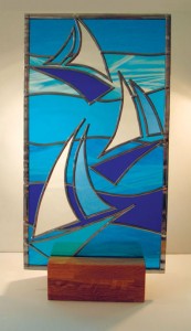 Stained glass yachts on oak plinth