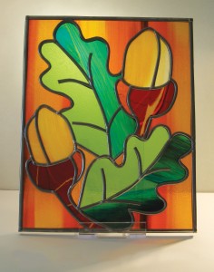 2 acorns on acrylic plinth