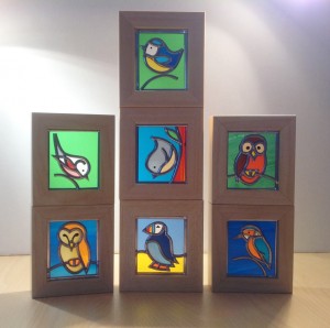 Stained glass birds in wooden frame