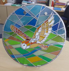 Stained_glass_circular_Flying_Barn_Owl